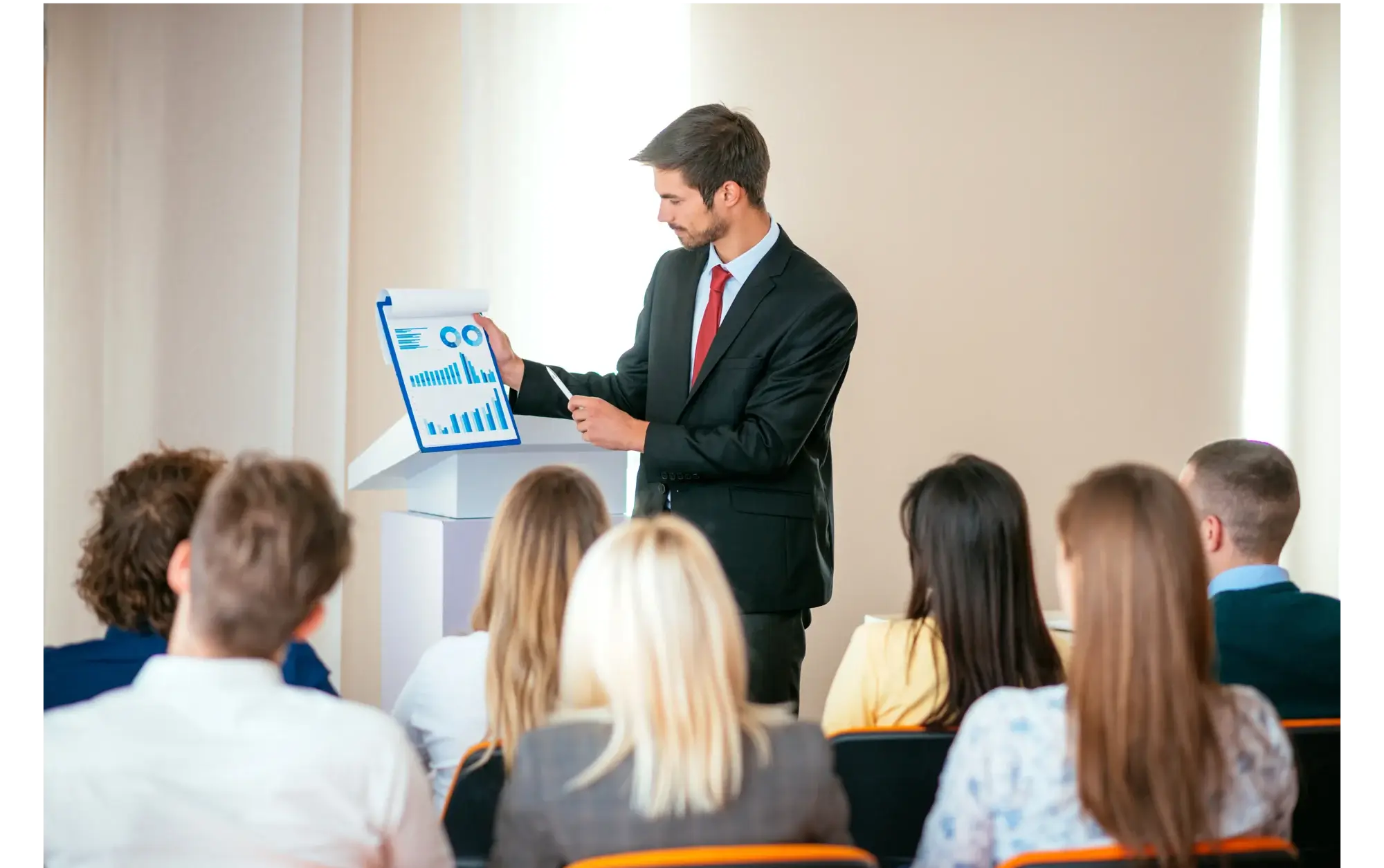 An advisor presenting to a group of women